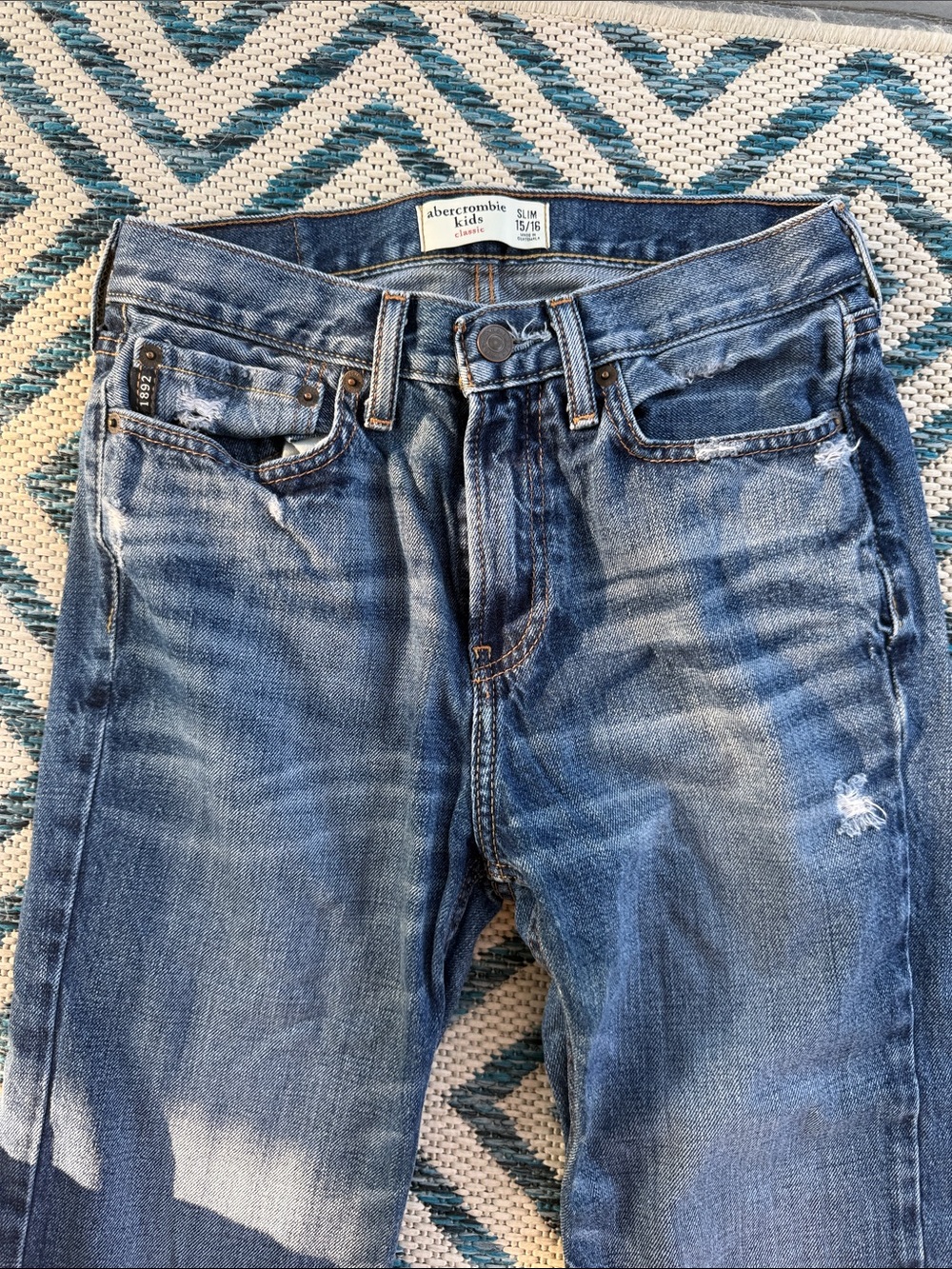 Abercrombie Kids mildly distressed blue jeans